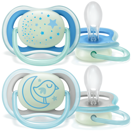 Two sets of baby pacifiers with night light feature on a white background