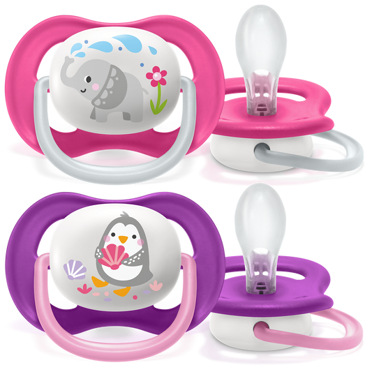 Two pairs of baby pacifiers with cartoon designs on a white background