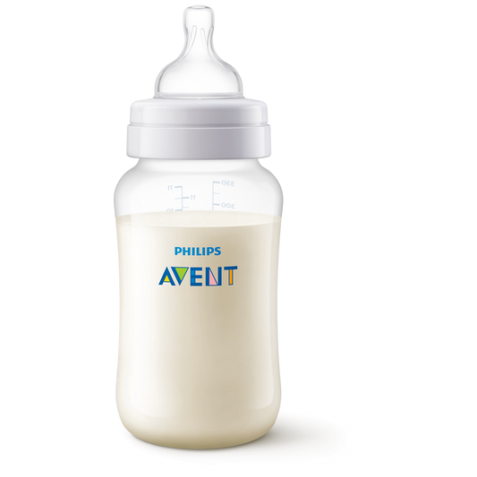 Philips Avent baby bottle with milk on a white background